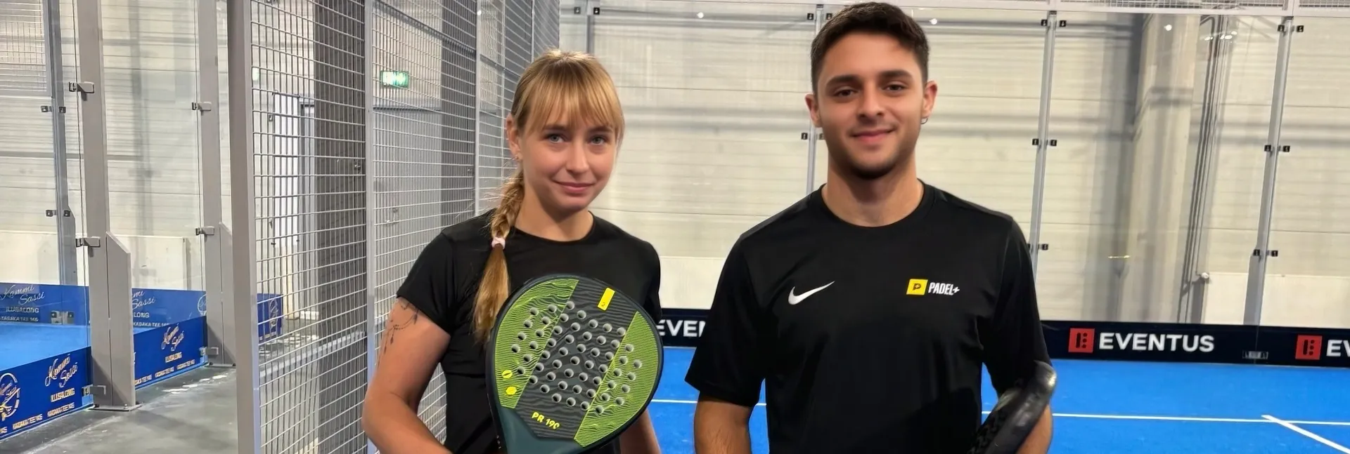 Padel trainer and a woman on a padel court