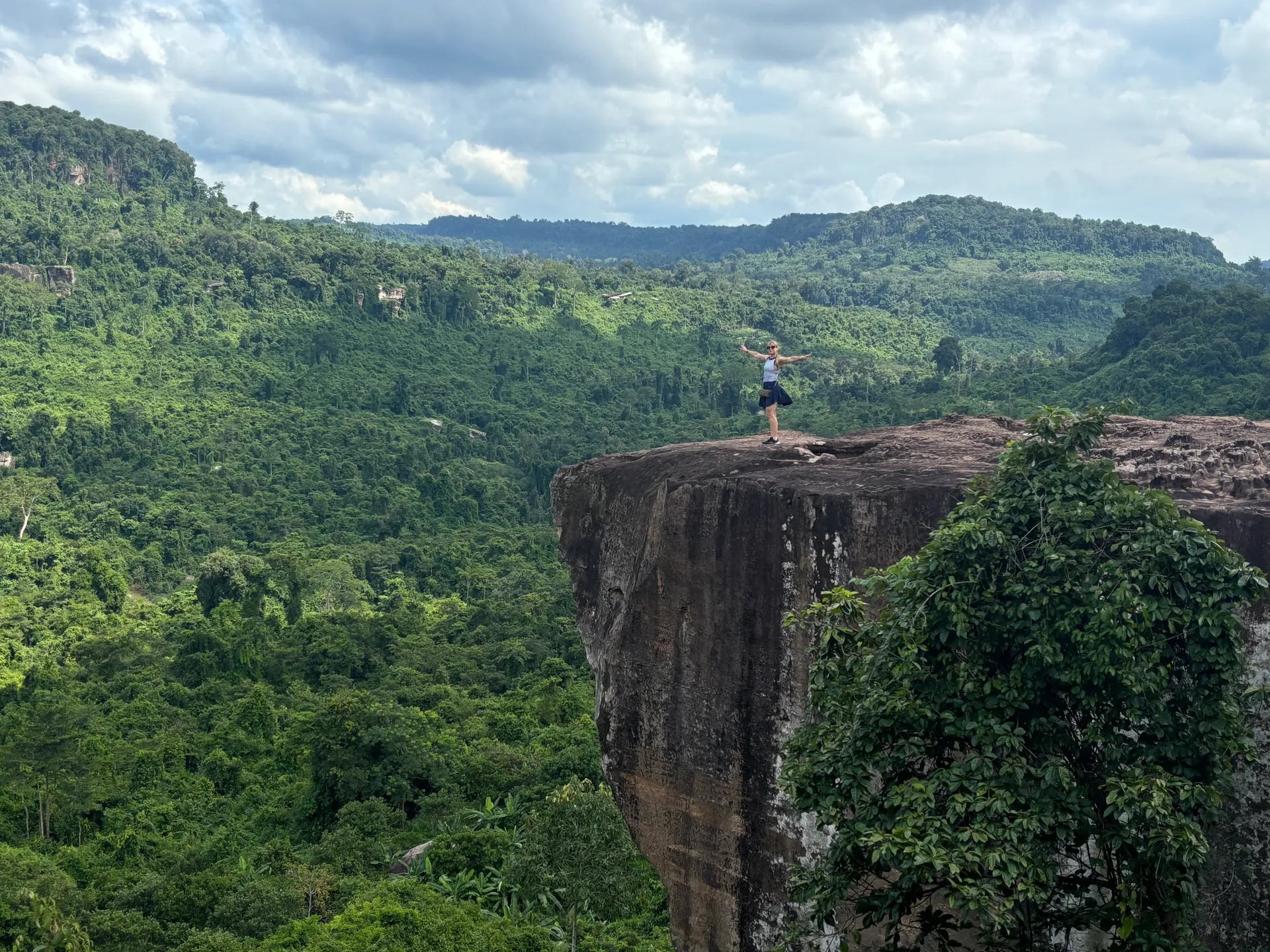 Woman standing on a cliff